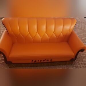 New, Orange Friends Couch Replica. "IT'S A BANK"
